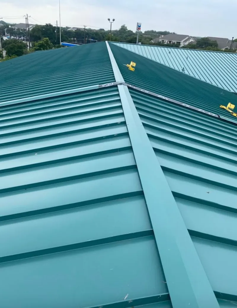 Green commercial metal roof ridge and valley for Metal Roof Repair in Woodfield